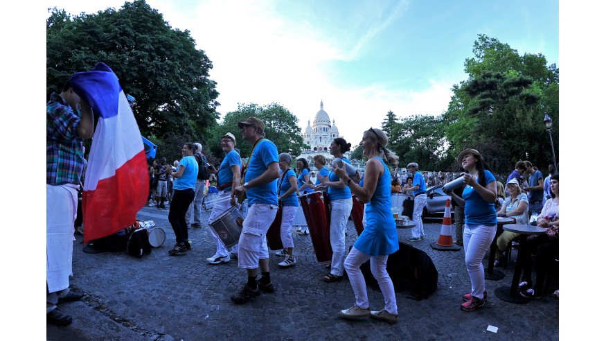 PARIS, FRANCE - JUNE 21:  People gather in the streets of Paris to celebrate the summer solstice during Fete De La Musique 2014 on June 21, 2014 in Paris, France. Fete De La Musique is an annual event held throughout France where musicians perform in